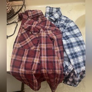Two size small men’s flannel button up long sleeve shirts
